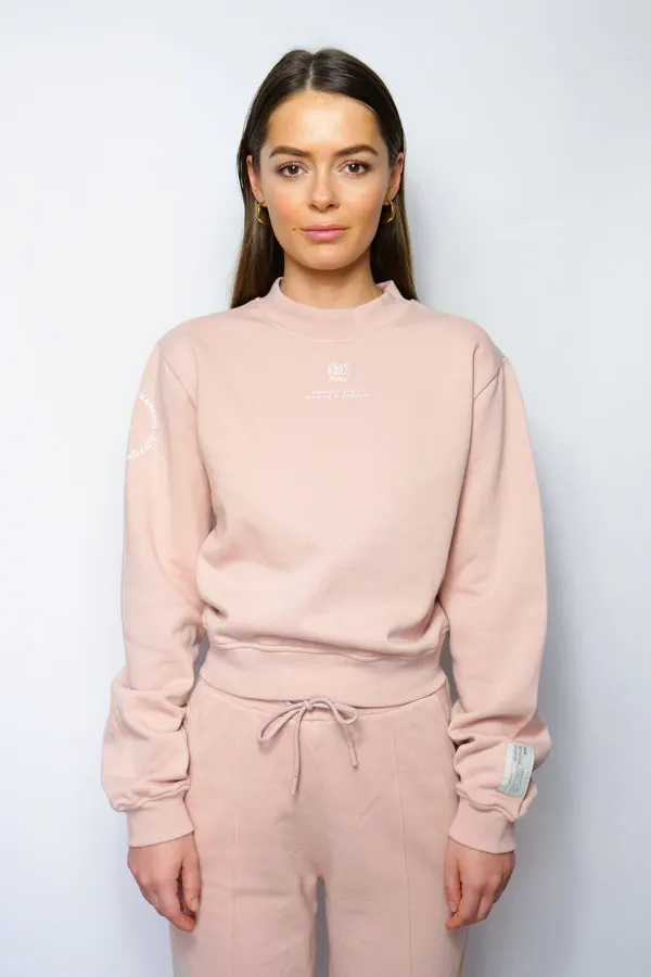 SUPPORT HUMANKIND PASTEL ROSE CROPPED SWEATSHIRT